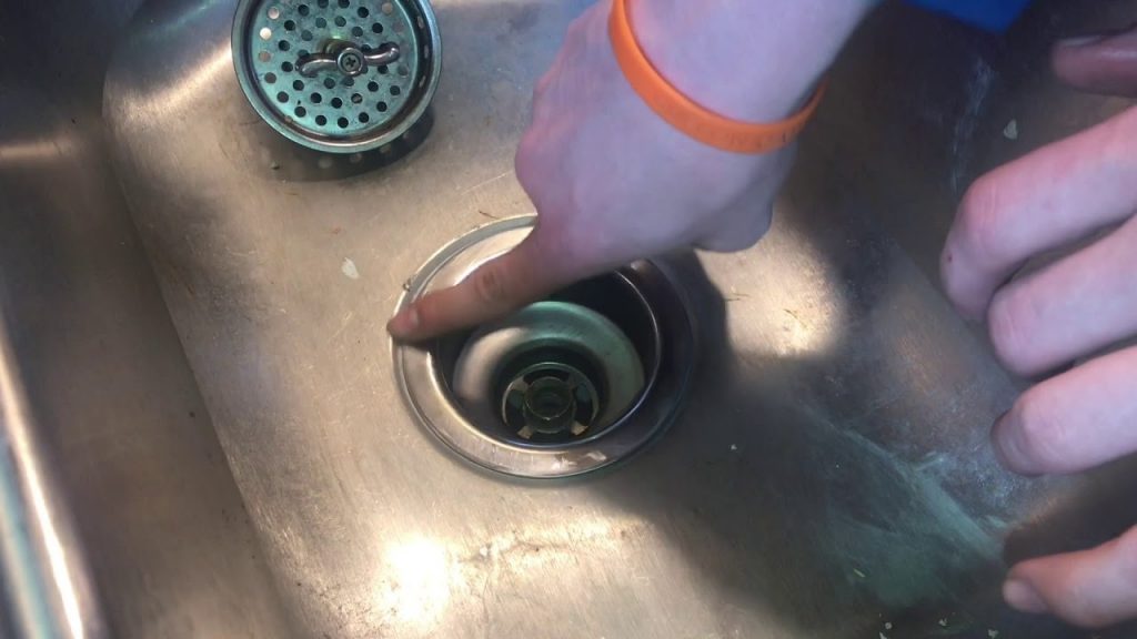 how to remove a garbage disposal sink flange