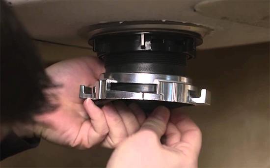 how to remove a garbage disposal sink flange
